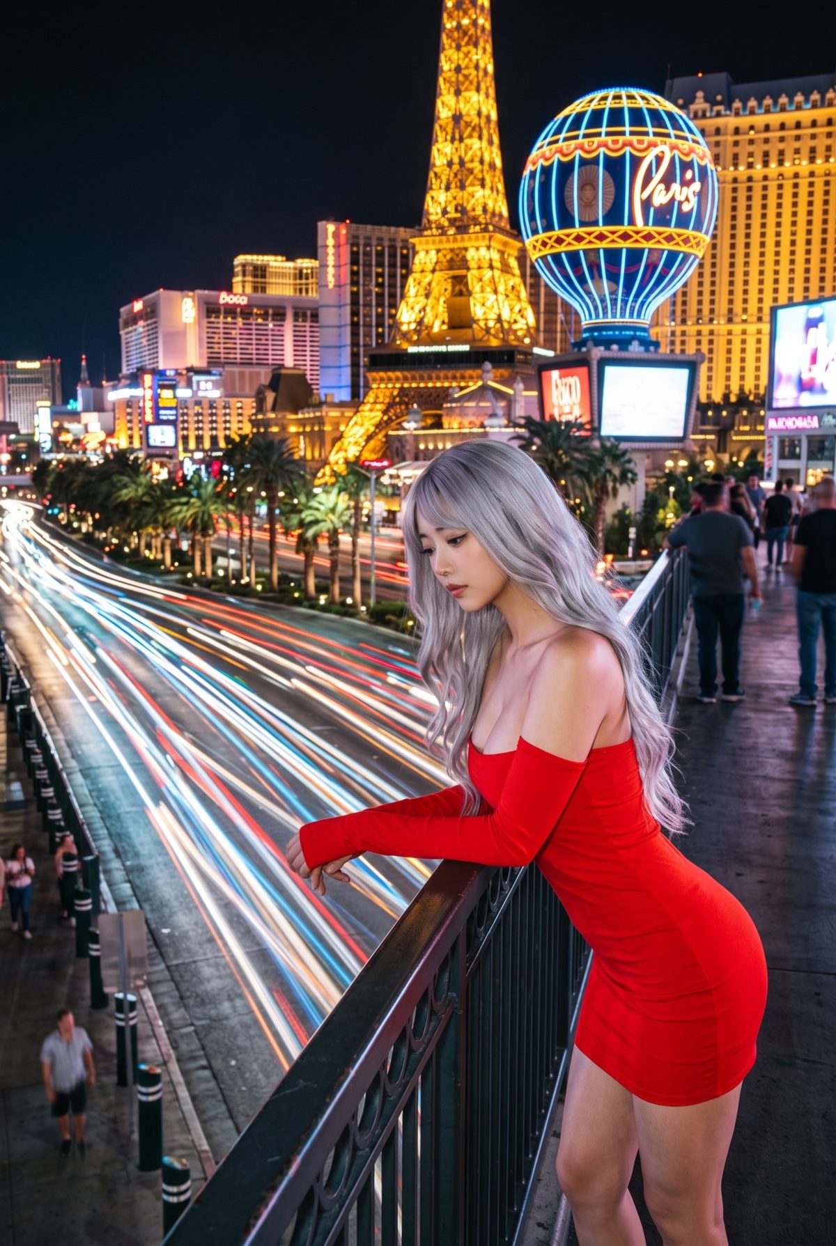ラスベガスの夜景を背景に手すりに寄りかかる赤いドレス姿の女性
